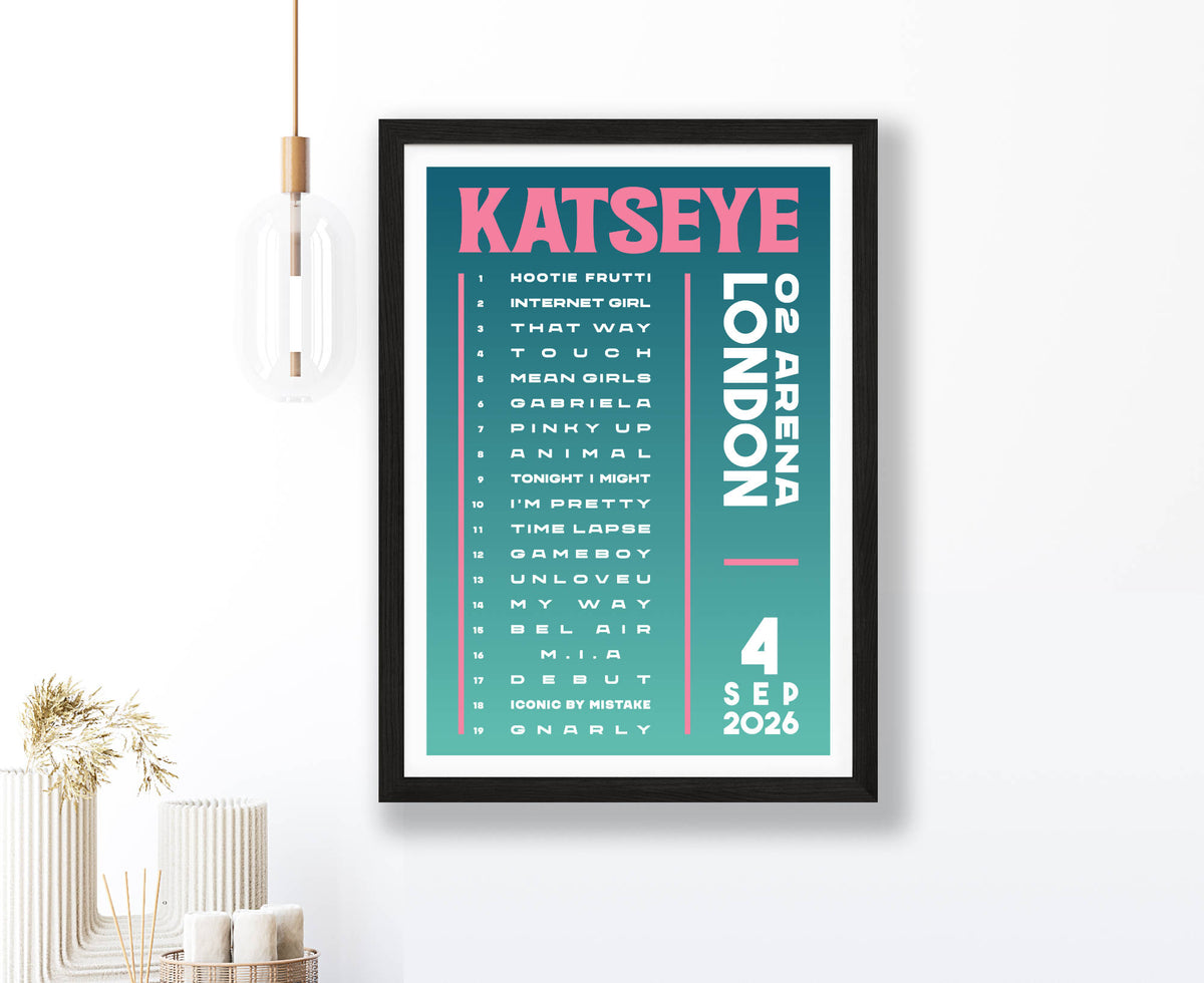 A setlist poster for Katseye at O2 Arena London on 4 September 2026 in a black frame on a white wall in a modern room setting with a hanging light fixture.